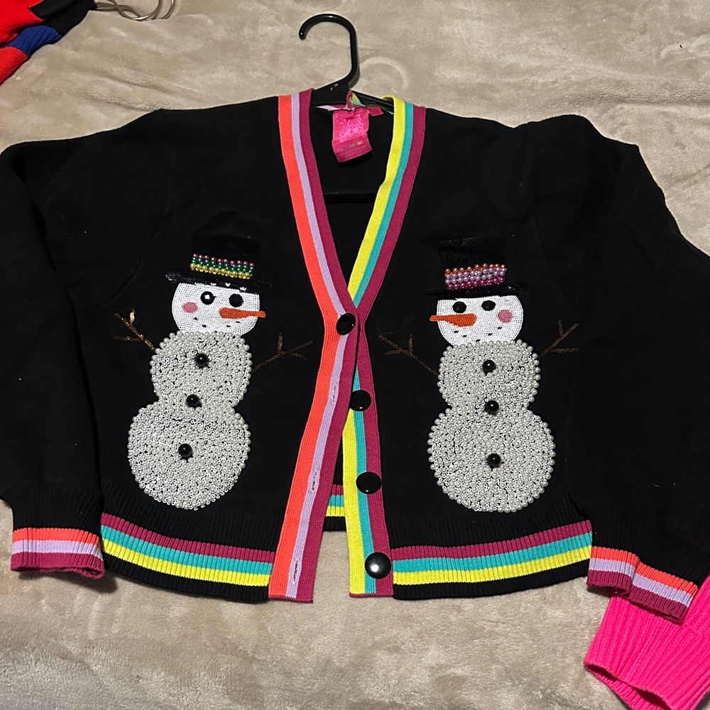 Queen of sparkle snowman cardigan sold out.